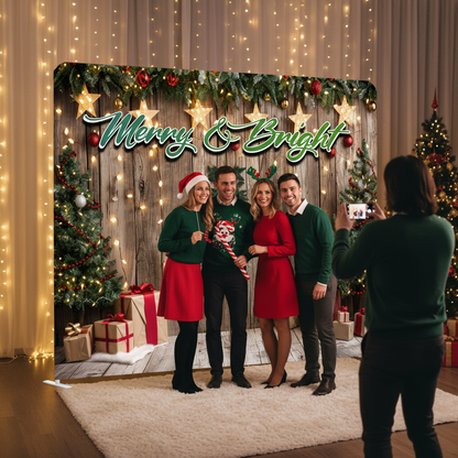 Group of people posing in front of a Christmas-themed backdrop with 'Merry & Bright' text.