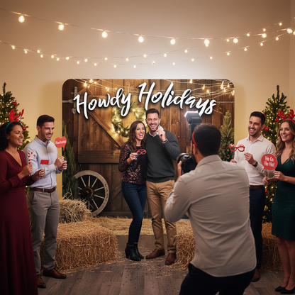 Group of people celebrating Christmas with 'Howdy Holidays' sign and festive decorations.
