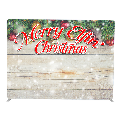 Christmas-themed backdrop with 'Merry Elfin Christmas' text and festive decorations on a wooden background.
