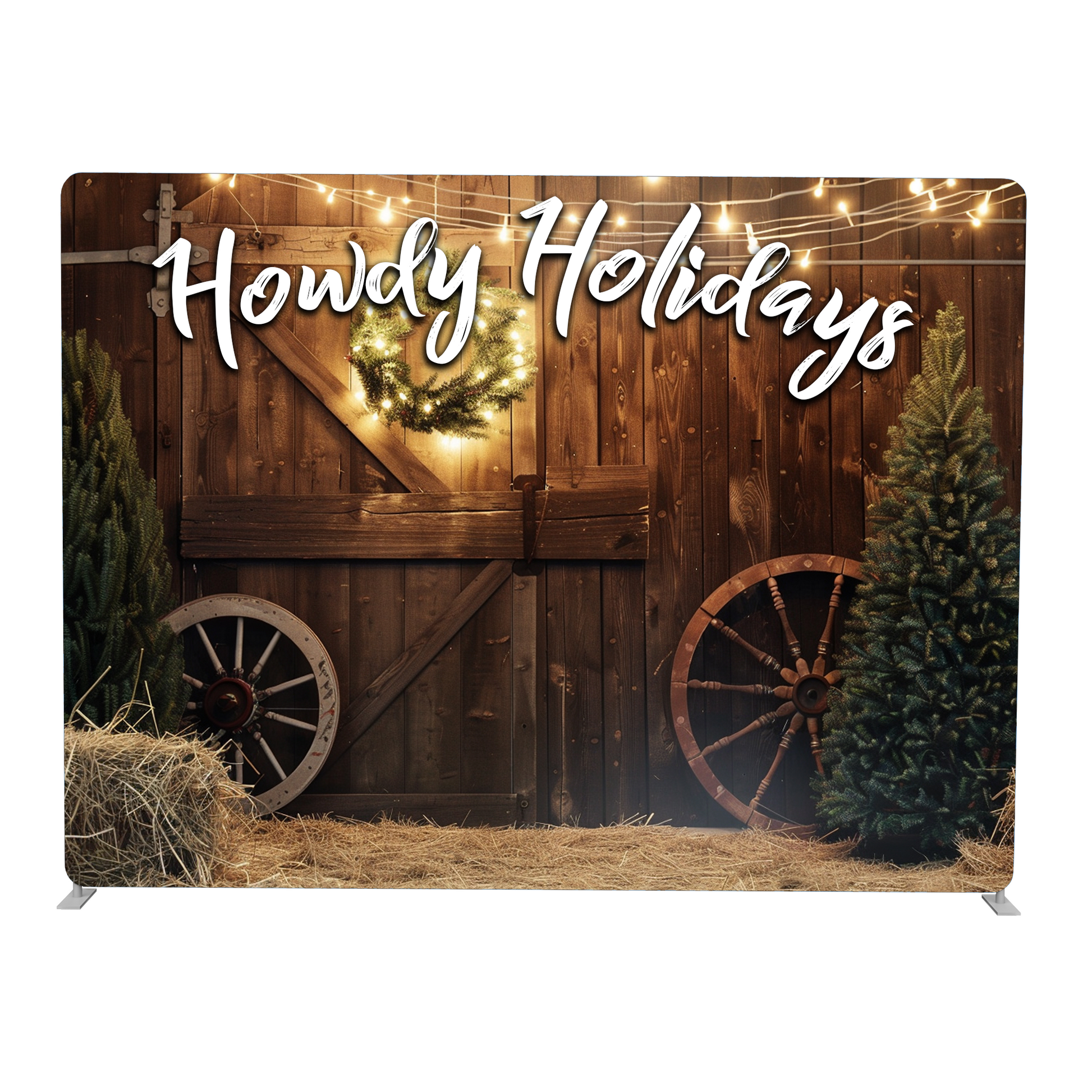Decorative backdrop with 'Howdy Holidays' text, wooden wagon, Christmas tree, and lights.